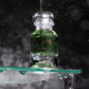 Flacon du parfum Larme de Lune, design mystique et élégant, inspiré par la douceur et l'éclat de la lumière lunaire.